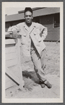 Man leaning with hand on hip