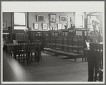 Interior, with display cases and tables, of 135th Street Division of Negro Literature, History and Prints