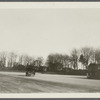 View of Basso's Buick leaving Southampton Depot. Southampton Hotel in background. Southampton, Southampton