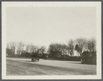 View of Basso's Buick leaving Southampton Depot. Southampton Hotel in background. Southampton, Southampton