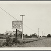 View of sign marking first street in Southampton and site of original village. Large building in background. NE corner Wickabogue Road and Old Town Street. Southampton, Southampton