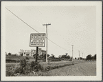 View of sign marking first street in Southampton and site of original village. Large building in background. NE corner Wickabogue Road and Old Town Street. Southampton, Southampton