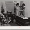 FSA (Farm Security Administration) home supervisor Miss Horton helping one of borrower's families cut pattern and make their own clothes. Caswell County, North Carolina.