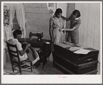 FSA (Farm Security Administration) home supervisor Miss Horton helping one of borrower's families cut pattern and make their own clothes. Caswell County, North Carolina.