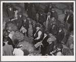 Tobacco auction in warehouse in Danville, Virginia where many Caswell County farmers sell their tobacco at auction. North Carolina.