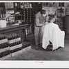 Free haircut on Saturday morning in W.M. Scott's general store. Farrington. Chatham County, North Carolina.