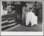 Free haircut on Saturday morning in W.M. Scott's general store. Farrington. Chatham County, North Carolina.