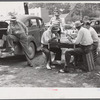 PTA of Prospect Hill, Caswell County serving and selling Brunswick stew dinner in Mebane, North Carolina on opening day of tobacco market, to raise money for a new gymnasium for the Prospect Hill consolidated school in Caswell County, North Carolina.