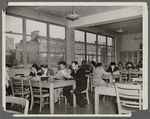 Patrons in reading room, including two men in military uniform