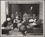 Dr. Samuel Sillen, Ralph Ellison, Lawrence Reddick, and William Attaway on the platform of the Harlem Library