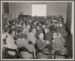 Young children in audience at movie screening at 135th St Branch Library