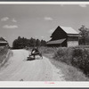 Wagon with stocks of meal on road in Corbett Ridge section. Caswell County, North Carolina.