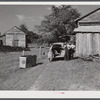 During the tobacco marketing season peddlers drive around to the tobacco barns and strip houses through the county to sell their wares to the farmers and tenants. Caswell County, North Carolina.