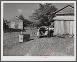 During the tobacco marketing season peddlers drive around to the tobacco barns and strip houses through the county to sell their wares to the farmers and tenants. Caswell County, North Carolina.