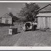 During the tobacco marketing season peddlers drive around to the tobacco barns and strip houses through the county to sell their wares to the farmers and tenants. Caswell County, North Carolina.