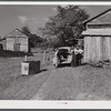 During the tobacco marketing season peddlers drive around to the tobacco barns and strip houses through the county to sell their wares to the farmers and tenants. Caswell County, North Carolina.