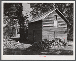 Storing barns and woodpiles on Emery Hooper's farm near Prospect Hill. Caswell County, North Carolina.