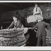 Farmers unloading their tobacco from their trailer in the baskets the night before auction sale in Hughes warehouse. Danville, Virginia.