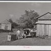 Peddler who come to tobacco farm on Emery Hooper's farm to sell them some meat. Corbett Ridge section near Prospect Hill. Caswell County, North Carolina.