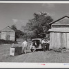 Peddler who come to tobacco farm on Emery Hooper's farm to sell them some meat. Corbett Ridge section near Prospect Hill. Caswell County, North Carolina.