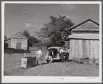 Peddler who come to tobacco farm on Emery Hooper's farm to sell them some meat. Corbett Ridge section near Prospect Hill. Caswell County, North Carolina.