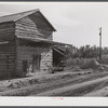 Tobacco barn, now used for storing supplies, on Emery Hooper's farm in Corbett Ridge section near Prospect Hill. Caswell County, North Carolina.
