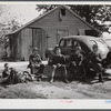 Resting after dinner following a corn shucking on Hooper Farm in Corbett Ridge section. Caswell County, North Carolina.