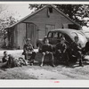 Resting after dinner following a corn shucking on Hooper Farm in Corbett Ridge section. Caswell County, North Carolina.