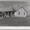 The W.H. Willis' home which they built themselves with a tenant purchase loan and the ground improvement and planting and landscaping they did on a work grant. Near Yanceyville, Caswell County, North Carolina.