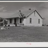 The W.H. Willis' home which they built themselves with a tenant purchase loan and the ground improvement and planting and landscaping they did on a work grant. Near Yanceyville, Caswell County, North Carolina.