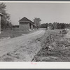 Spreading lime to increase productivity of soil before planting winter wheat on Emery M. Hopper's tobacco farm in Corbett Ridge section. Caswell County, North Carolina.