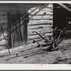 Plows in front of tobacco barn on Emery Hopper's farm in Corbett Ridge section. Caswell County, North Carolina.,