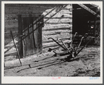Plows in front of tobacco barn on Emery Hopper's farm in Corbett Ridge section. Caswell County, North Carolina.,