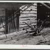 Plows in front of tobacco barn on Emery Hopper's farm in Corbett Ridge section. Caswell County, North Carolina.,