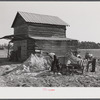 Spreading lime to increase productivity of soil before planting winter wheat on Emery M. Hooper's tobacco farm in Corbett Ridge section. Caswell County, North Carolina.