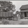 In the fall of the year after the crops are up many tenants and share croppers move into another farm. This Black family was moving from this home near Yanceyville to one near Raleigh, North Carolina. Caswell County, North Carolina.