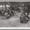 Citizens of Caswell County listening to speakers after a picnic and barbecue at the CCC (Civilian Conservation Corps) camp. They had just attended a county land use planning meeting in the courthouse in Yanceyville, North Carolina.