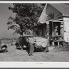 Farmer with load of tobacco which he is taking to market to be sold at auction in warehouse. This is in front of Carver's store. Corbett Ridge section, Caswell County, North Carolina.