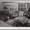 E.O. Foster, FSA (Farm Security Administration) tenant purchase borrower, grading and stripping tobacco on his farm near Yanceyville. Caswell County, North Carolina.