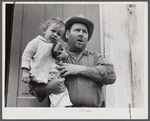 French muskrat trapper with neighbor's child. Delacroix Island, Saint Bernard Parish, Louisiana.
