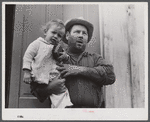 French muskrat trapper with neighbor's child. Delacroix Island, Saint Bernard Parish, Louisiana.