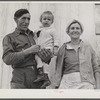 Spanish muskrat trapper, his wife and their adopted child by their marsh camp. Delacroix Island, Saint Bernard Parish, Louisiana.