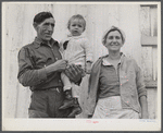 Spanish muskrat trapper, his wife and their adopted child by their marsh camp. Delacroix Island, Saint Bernard Parish, Louisiana.
