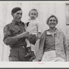 Spanish muskrat trapper, his wife and their adopted child by their marsh camp. Delacroix Island, Saint Bernard Parish, Louisiana.
