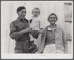 Spanish muskrat trapper, his wife and their adopted child by their marsh camp. Delacroix Island, Saint Bernard Parish, Louisiana.