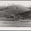 Josh Calahan's old home and barns with corn field on the hillsides. Southern Appalachian Project near Barbourville, Knox County, Kentucky.