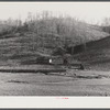Josh Calahan's old home and barns with corn field on the hillsides. Southern Appalachian Project near Barbourville, Knox County, Kentucky.