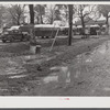 Jones Trailer Camp where army men and construction workers and their families live. They pay two dollars and fifty cents weekly for space only. One said "It's nothing but a mud hole, only running water, you can't find a decent place to live in Columbus, and nobody will allow children in their homes--it's a shame. We was all children once. Most folks got children.".