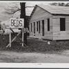 Sign on highway No. 165 near Fort Beauregard (beds and heat). New construction in background. Alexandria, Louisiana.