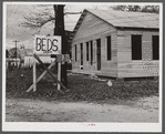 Sign on highway No. 165 near Fort Beauregard (beds and heat). New construction in background. Alexandria, Louisiana.